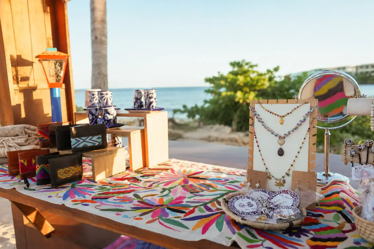 Curated Alma amenity display arranged on a resort bed